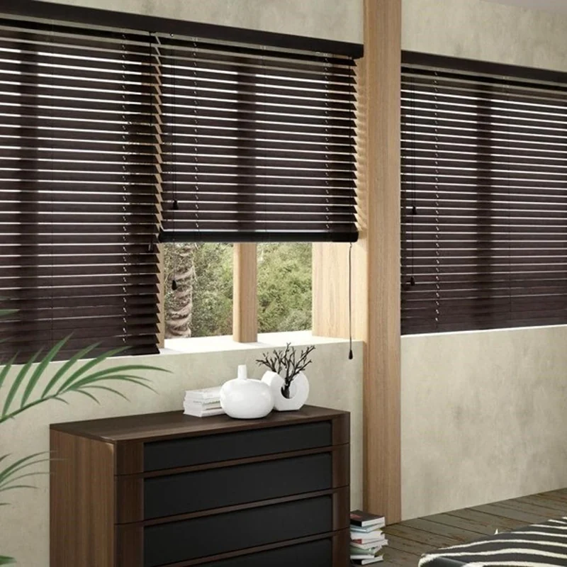 Close-up of dark wooden blinds on a sunny window.