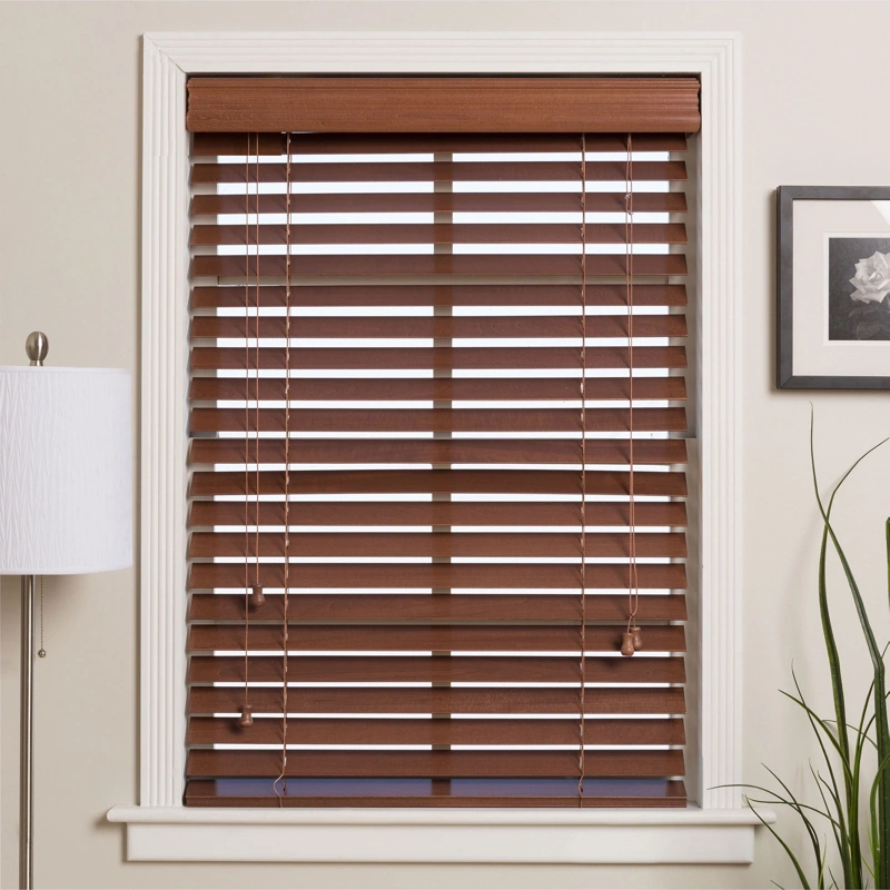 Dark wooden venetian blinds on a white window frame.
