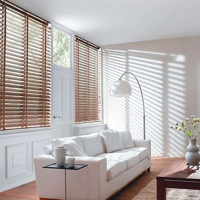 Sunlight filtering through wooden blinds in a living room
