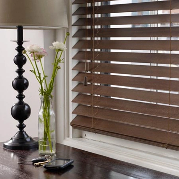 Brown basswood blinds on a window