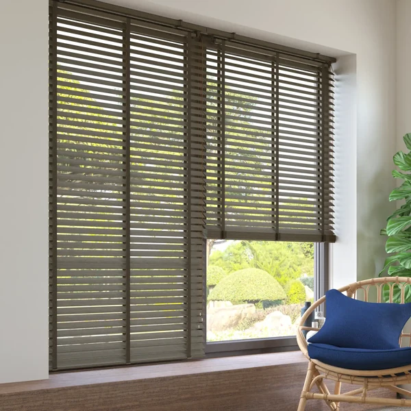 Wide view of brown wooden window blinds